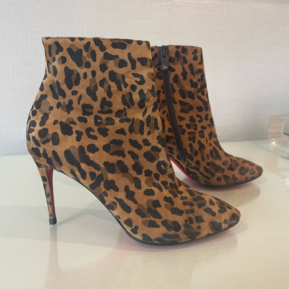Christian Louboutin animal print heels. Excellent condition. Size 7. Dust bags!